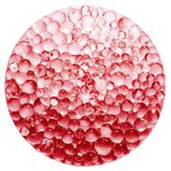 A close-up of a circular arrangement of pinkish-red bubbles, creating a visually appealing texture and pattern.