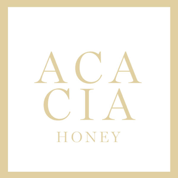 Logo design featuring the words "ACACIA HONEY" in elegant, gold typography on a white background, framed by a light gold border.