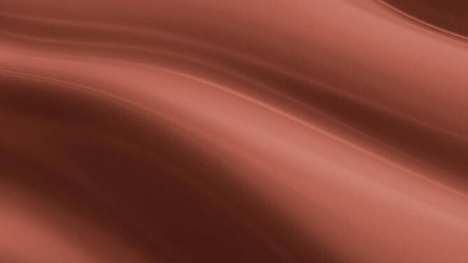 A smooth, flowing texture in warm shades of brown, creating a sense of depth and movement.