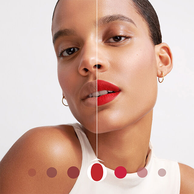 Close-up of a woman with short hair, showcasing a makeup look split down the middle: one side features a natural look, while the other displays bold red lips. A color palette is shown below. The background is plain and light.